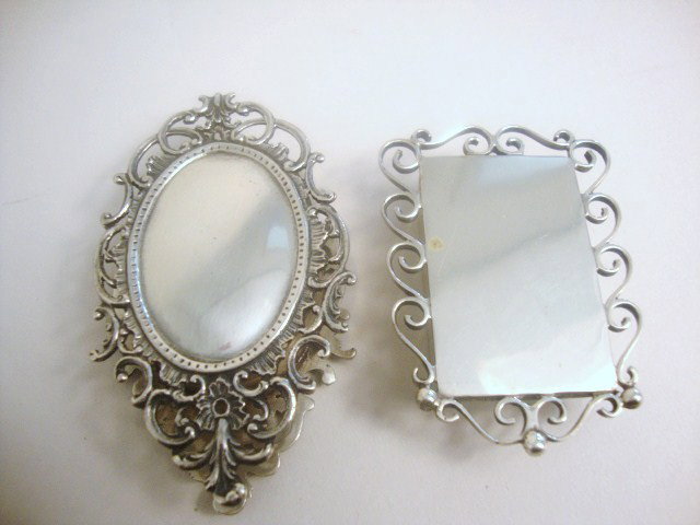 Meyers Sterling Picture Frame Pill Boxes: Two Meyers sterling picture frame-style pill boxes, both with elaborate framing and opening from the the tops. Signed "M" Sterling handmade 2.5" largest,