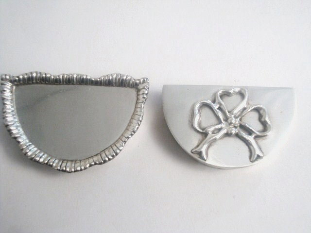 Meyers Sterling Pill Boxes: Two Meyers sterling pill boxes, one with gadroon edging, one with applied bow, both in demilune style, marked "M" Sterling handmade 2.25" largest