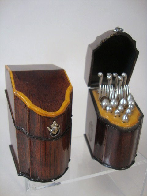 Pair of Mahogany Knife Boxes: A stunning vintage matched pair of George II mahogany knife boxes with cherry and lemonwood banding and interior surfaces, exquisite patina, fully furnished with William Meyers sterling flatware. Each
