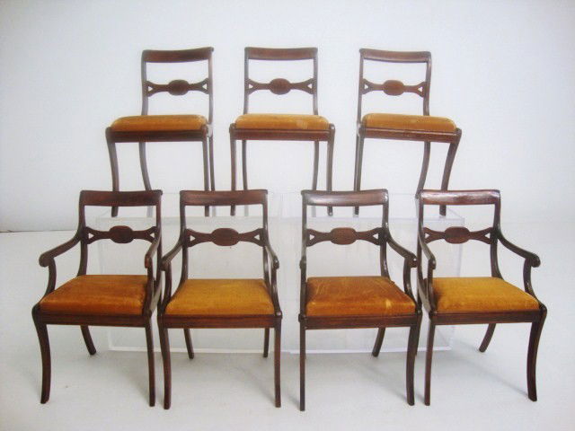 Set of Seven Dining Chairs: An elegant set of seven Duncan Phyfe dining chairs with original iridescent gold silk upholstered seats, scaled to match the table in the previous lot. Four armchairs(one with repaired arm) and three
