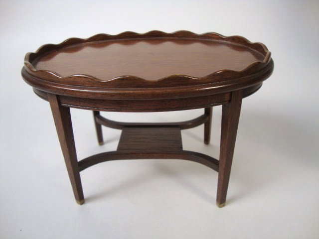 Oval Mahogany Occasional Table: Pretty oval Hepplewhite style tea table with scalloped decorative gallery, beautifully finished. 6" L, 4" W and 3.75" H.