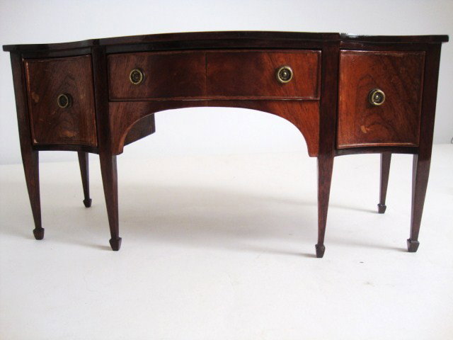 Hepplewhite Sideboard: Magnificent mahogany Hepplewhite sideboard with serpentine front, spade feet, bookmatched flame mahogany veneered doors and drawer front (dovetailed drawer) and exquisitely formed brass hardware. This