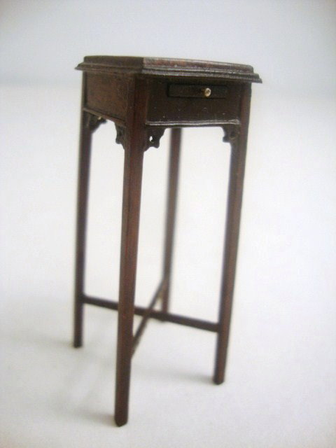 Eric Pearson Chippendale Teapot Stand: Extremely delicate mahogany teapot or candle stand with carved and pierced brackets and cross brace, raised molded gallery and tiny pull-out shelf. Exquisite. 2.25" H, 5/8" W and D.