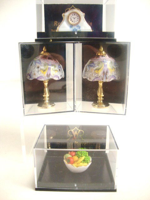 Reutter Porcelain Accessories: A pair of brass table lamps with porcelain shades 2" H, a porcelain shelf clock and bowl of fruit, all made in Germany by Reutter and in original boxes.