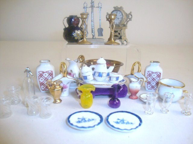 Assortment of Vintage and Modern Accessories: Vintage gilt cast metal clock (missing figural finial), a pair of gilt metal candlesticks, a soft metal set of fireplace tools, and assorted glass and pottery. Approximately 36 pieces. Clock is 1.5" H