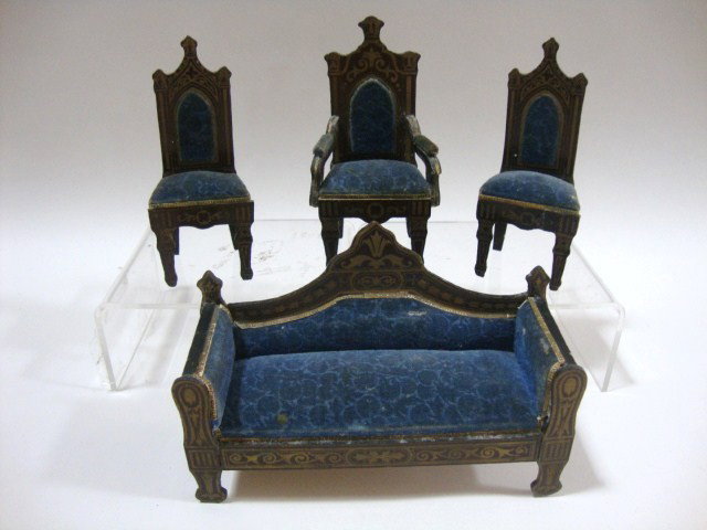 Waltershausen Gothic Parlor Set: An antique German parlor set comprising a settee with 6" L, 4" H and four matching chairs, all featuring elaborate gilt transfer decoration, sculpted blue velvet upholstery and gilt paper trim. One ch