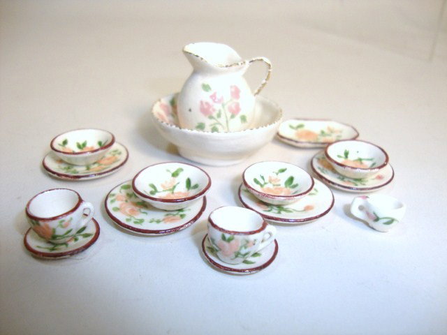 Elisabeth Andrews Dinnerware: Thirteen pieces of dinnerware hand-decorated with roses by Elisabeth Andrews. Also an unmarked pitcher and bowl. Pitcher 1" H.