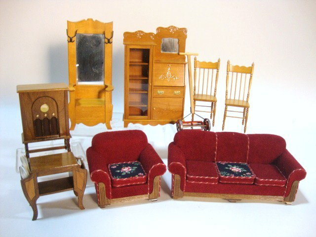 Robert Carlisle Parlor Suite: 1920's parlor furniture including overstuffed sofa and matching chair, hall tree, desk, magazine table, two chairs and his iconic floor model radio 3.5" H, 2.25" W. Also the lawnmower someone should b