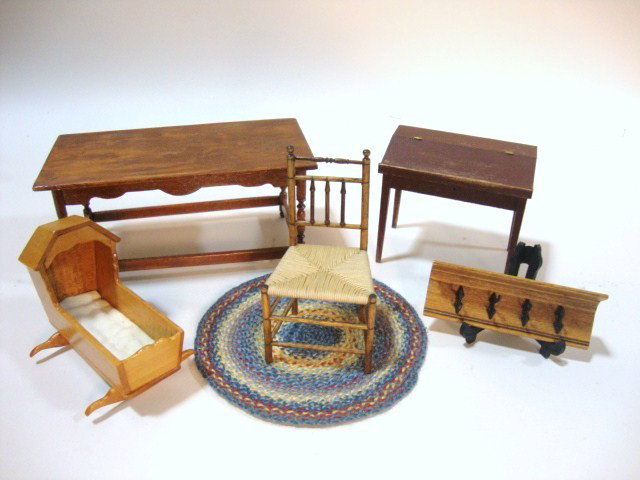 Sir Thomas Thumb Wall Rack: A country wall rack signed by Sir Thomas Thumb and an assortment of unsigned country furniture including a table 5.25" L, 2.5" W and H, schoolmaster's desk, hooded cradle. Finely turned spindle back c