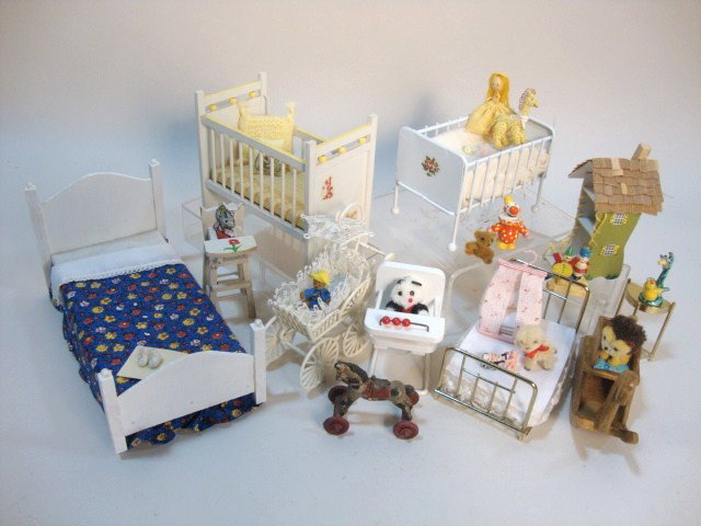 Nursery Furniture: An assortment of painted nursery furnishings including a nice crib 4.25" L, 4" H, two children's beds, a metal crib, a pram, two high chairs and dollhouse shaped like an old woman's shoe.
