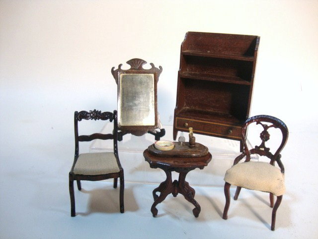 Carl Forslund and Eric Pearson Furniture: Three pieces of Carl Forslund furniture including two re-upholstered chairs 3" H and a small table, all over-varnished, a pipestand, an English mahogany bookcase (glue spots) and an Eric Pearson Chipp