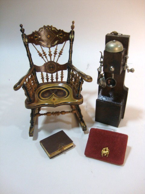 Remarkable Victorian Rocker: A most unusual rocking chair 5" H, 3.5" W, 4" D made from polychromatic laminated wood with wood and mother-of-pearl inlays on many surfaces, fine turned joinery (one finial replaced and two spindles 