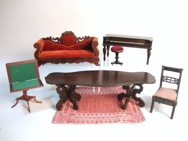 Artisan Victorian Furniture: Unusual hand-crafted Victoriana including a massive sofa 7.5" L (small loss to carvings), an attractive square piano with movable keys, a long table, carved chair (missing seat) and a card table.