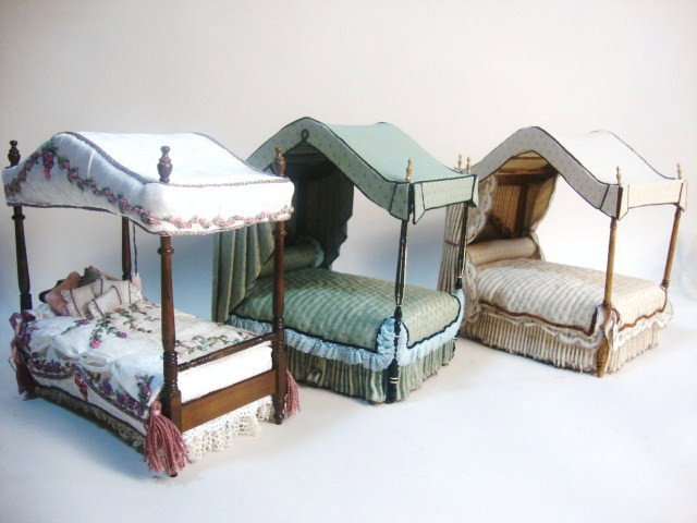 Artisan Canopy Beds: Three very handsome canopy beds approx 7"L, 5" W and 7.5" H. Two very similar examples by Margaret Sloman, a narrower bed with ribbonwork embroidery by "Pat".