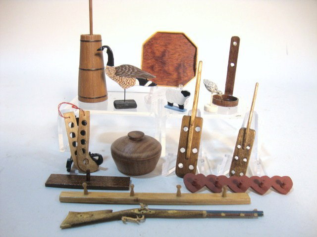 Wooden Rifle and Accessories: A lot of wooden accessories including peg racks, a rifle 4" L, turned bowls, beautifully hand-painted bird figures, and a plastic butter churn