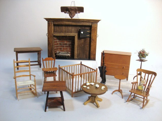 Jennifer Johnson Shaker Furniture: A blanket chest 3.5" L and 3" H, a rocker, tall cupboard and stand all signed by Jennifer Johnson, a country fireplace, two tables, a round table with child's teaset, high chair and playpen. All nicel