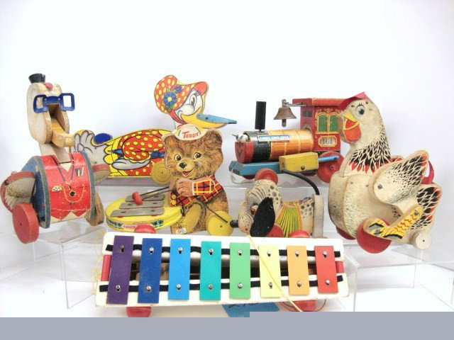 Fisher-Price Toy Lot: Seven miscellaneous Fisher-Price toys including 423 Granny Goose, Dr. Doodle, Teddy Zilo, #120 Cackling Hen, Looty Chug-Chug, Nosey the Dog and Pull-a-Tune