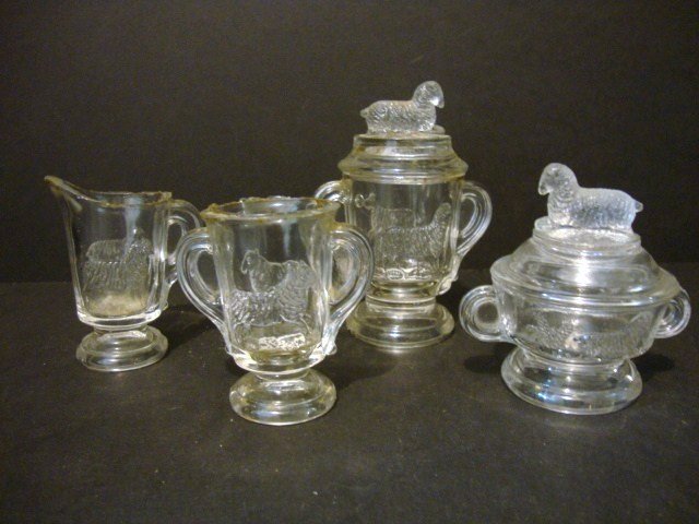Lamb Table Set: Four piece Lamp Table Set in Clear: Creamer, covered sugar, covered butter, spooner, 4.5" H.