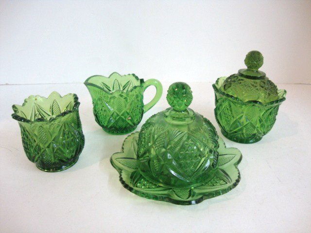 Child's Pennsylvania Green Table Set: Four piece Pennsylvania Green Table Se: Creamer, Covered Sugar, spooner and covered Butter, 3 7/8" H.