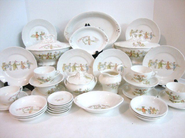 Child's Kate Greenaway Dinner Set: Thirt-seven Pieces Kate Greenaway Dinner Set by Cleve-ron China: Two Covered Casseroles, Three Serving Dishes, Six Bowls, Six Platters, Six Cups and Saucers, sugar, Creamer, Six Butter Dishes. 5" H.