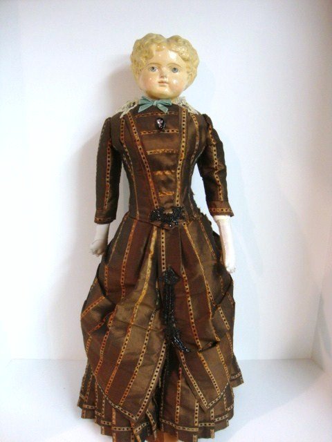 Early Papier Mache Doll: Early Papier Mache , 23", blond painted hair, blue painted eyes, cloth body, bustle and bust. Lovely Vintage clothing.