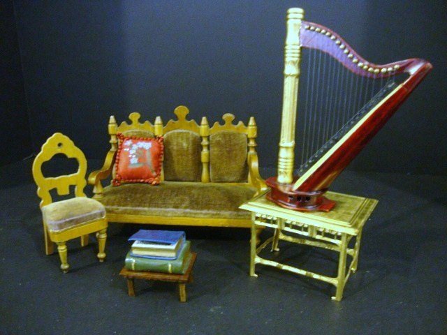 Schneegass Music Room: Antique Schneegass upholstered settee 4.5" H, 6" L (back legs replaced), Schneegass balloon-back chair (one leg reglued), an Ehrhard & Sohne Egyptian Revival ormolu library table 2.5" H, 3.25" L, mode