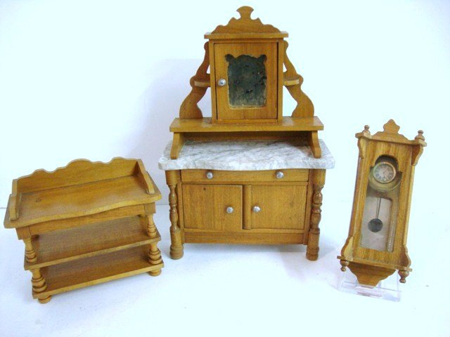 Antique Schneegass Dining Furniture: A mirrored sideboard 7" H, 4.5" W (slight loss to mirror, old glue repair where top joins base), a rare three-tiered serving table and a wall clock with pendulum (loose glass).