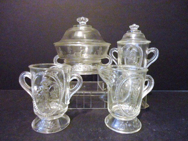 Child's Acorn Table Set: Four piece Acorn Table Set in clear glass: Creamer, Covered Sugar, Covered Butter, Spooner 4 1/8" (t)