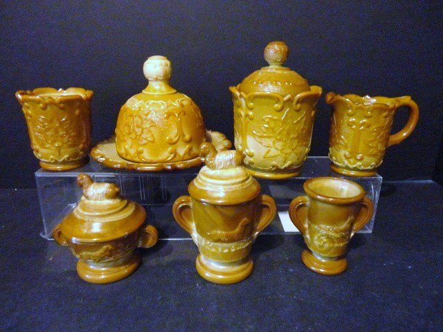 Child's Sultan Carmel Slag Glass Table Set: Caramel Slag Sultan Pattern Table Set, plus additional piece: Creamer, Covered Sugar, Covered Butter, Spooner, and additional pieces 4 1/2" (t). McKee Glass