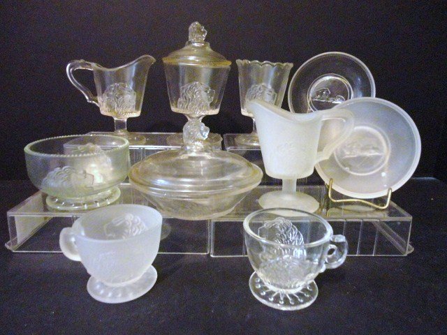 Child's Lion Set & Additional pieces: Ten pieces Lion Clear and Frosted Table set and Misc. Pieces, Four piece table set in clear: Creamer, Covered Sugar, Covered Butter, and Spooner, Cup and saucer, frosted creamer, and cup and saucer an