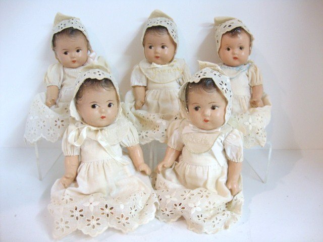 Madame Alexander Dionne Quints in Basket: 8" Madame Alexander Quints in Basket, most have original clothing, four dolls are marked, one has no marking. differnt color bib on non marked doll.