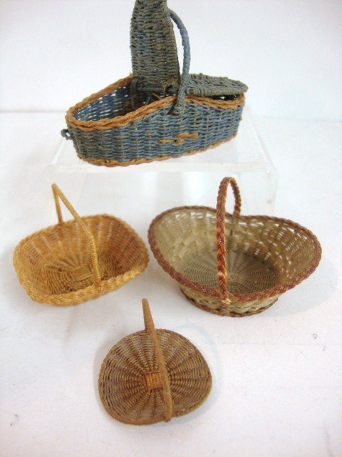 Joan Rankin Baskets: Four baskets crafted by Joan Rankin including a blue picnic basket 2" L and three open flower baskets, finely made.