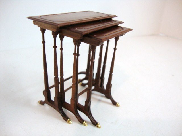 Ferd Sobol Nesting Tables: A set of three carefully fitted graduated nesting tables with incised tops and brass feet 2.5" H by Ferd Sobol. From the Legacy Collection.