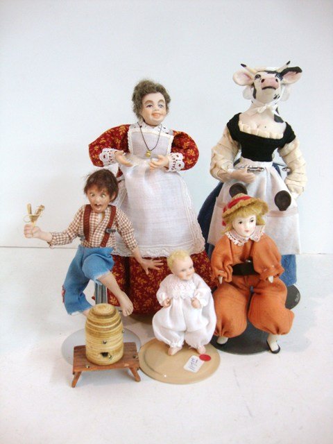 Assorted Dollhouse Dolls: A cow lady by Miss Lulie 6" H, a smiling cook and boy stung by bees by Dawn Adams and a vintage South African doll. Also, a lovely infant by Joyce Metcalf.