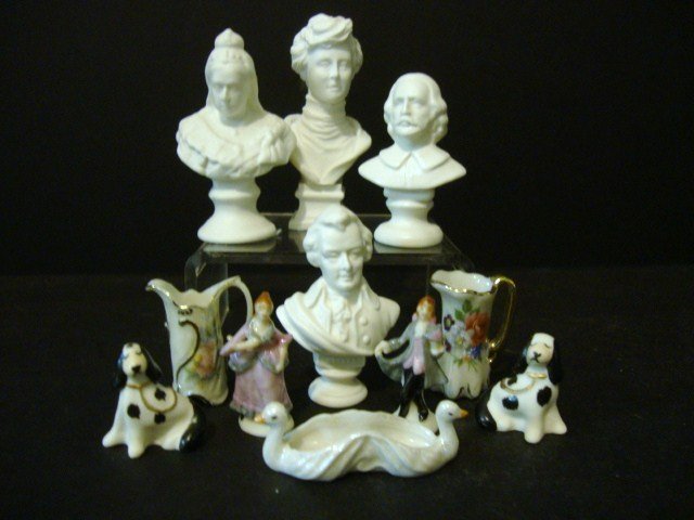 Stapleton China: An assortment of Parian busts including Shakespeare and Queen Victoria (tallest 2.25" H), two tall pitchers, a pair of Staffordshire spaniels, a lustre swan planter and pair of Dresden figurines, all 