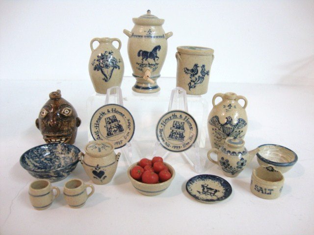 Jane Graber Pottery: Large assortment of Jane Graber stoneware including a water dispenser 1.75" H, plates, bowls, crocks, salt, and unusual Southern "grotesque head" folk art jug, 13 pieces.