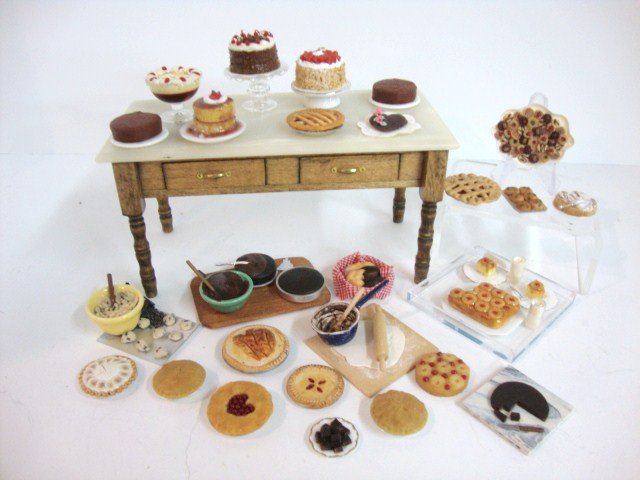 The Baker's Table: B. Hoffman "marble" topped work table with two drawers 5" L, 2.5" H and a mouth-watering assortment of baked goods to tempt the most conscientious dieter. Yum!