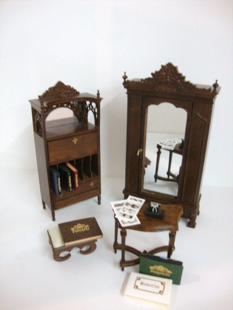 Bespaq Cabinets: A mirrored armoire 7" H and an unusual album cabinet with assortment of faux photograph and postcard albums, both by Bespaq, a small console table by Fantastic Merchandise and a Sonia Messer footstool