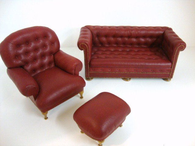 Gail Steffey Upholstered Furniture: A Chesterfield sofa upholstered in red leather 6" L 2.5" H and a comfy armchair and footstool by Gail Steffey.