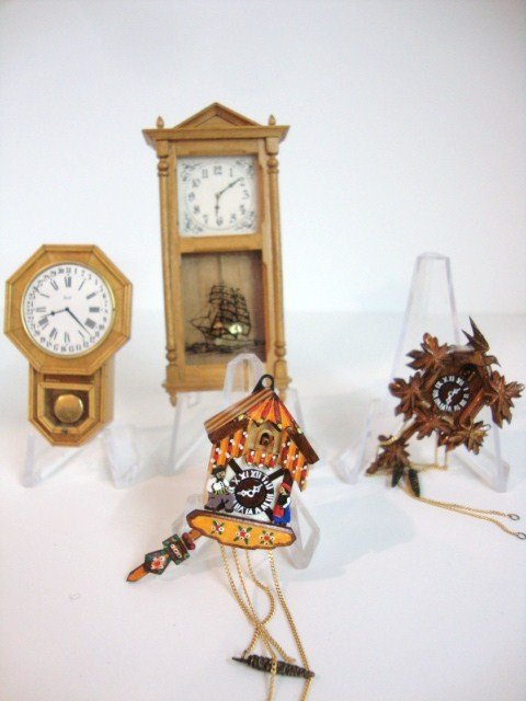 Victor Franco Cuckoo Clock: Two delightfully detailed cuckoo clocks by Victor Franco, a regulator clock signed ECL, and a pendulum clock 3" H by Anker Rasmussen.