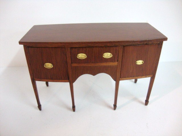 Dennis Jenvey Sideboard: Hepplewhite mahogany sideboard 4.5" L, 2.75" H with spade feet, oval brass drawer pulls, slight shrinkage separation on one side of the front apron, otherwise perfect and signed by the artist 1993.