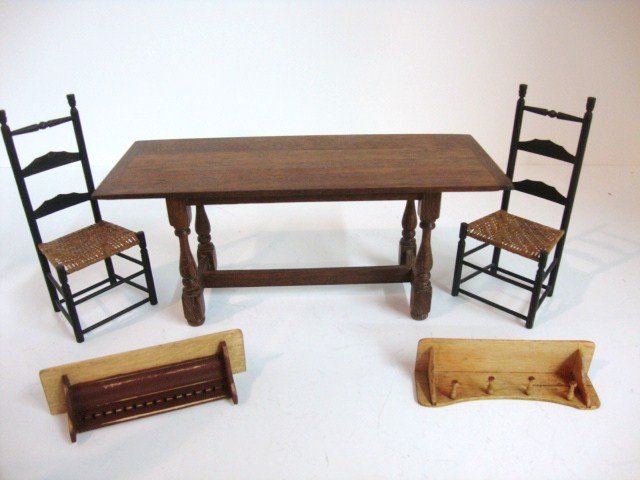Guy Roberts Table: Walnut trestle table 6"L, 2.5" H, a pair of Robert Henslen ladder-back chairs, a Cindy Malon peg rack, and a wall shelf signed C. Duekman '99.