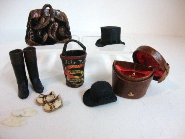 Dolls' Cobbler Luggage: Luggage and Men's Hats by Sylvia Rountree including a very handsome top hat with leather carrying case 1.25" H, bowler, riding boots, carpet bag and fire bucket. Also a child's socks and sneakers by a