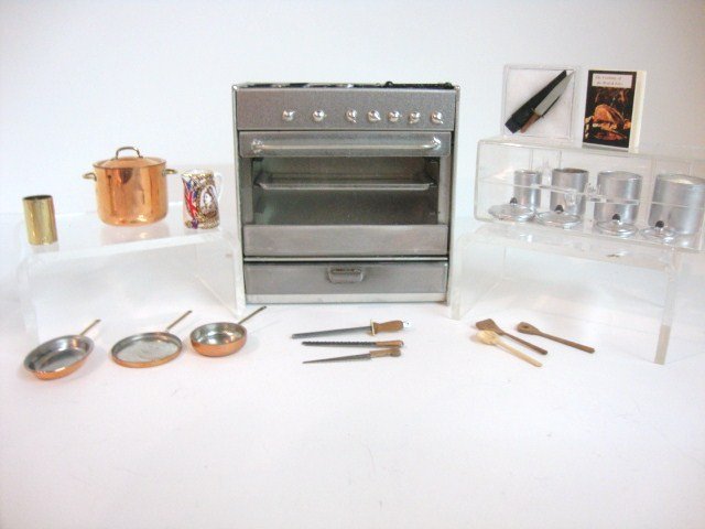 Modern British Kitchen Items: A stainless steel gas range by Ken Ketteridge 3" H and W with an assortment of accessories including a canister set, copper pots and pans, knives and Queen Victoria commemorative pitcher.