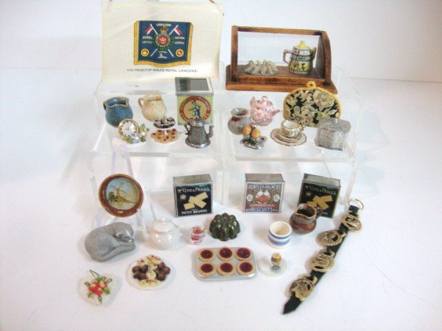 British Tea Room Accessories: Nice assortment of peculiarly British accessories for a tea room such as a harness of horse brasses 3.5" L, biscuit tins, cucumber sandwiches, tea caddy, jam tarts, Liberty tea cozy, and assortment of