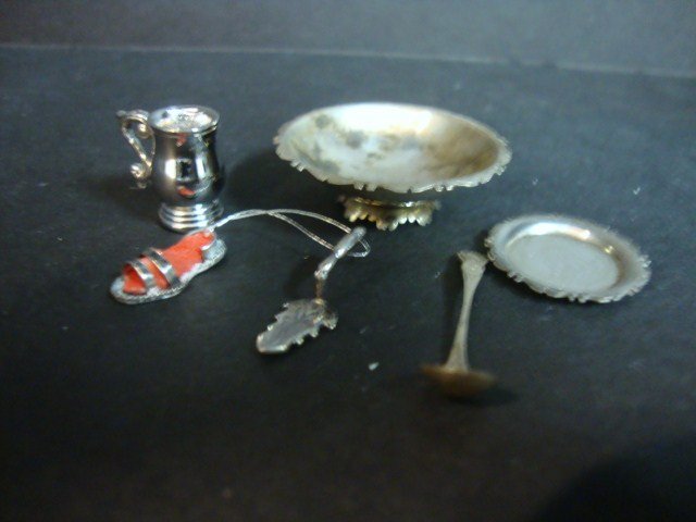 Geoffrey Bishop Silver Ladle and Salver: A silver punchbowl ladle 1" L and a small salver engraved with a tall-masted ship by Jeffery Bishop. Also a pretty pie server by Else Keuker Hardenberg 3/4" L, a silver sandal ornament by Ligia Durste