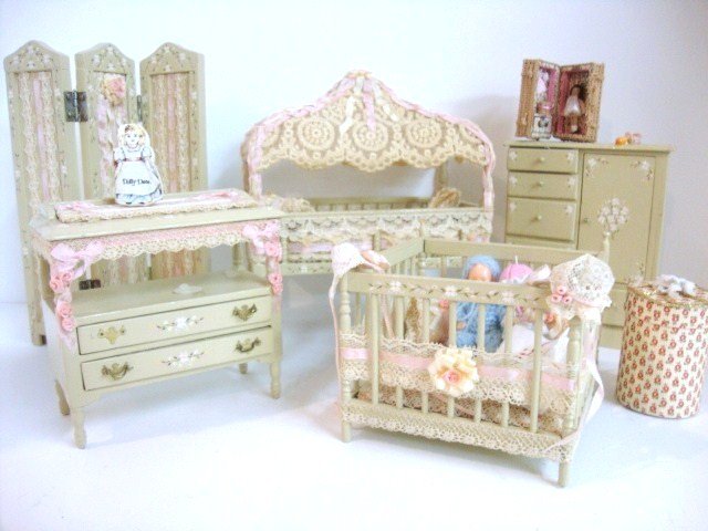 Artisan Nursery Furniture: A very pretty set of painted nursery furniture signed P. Bolton comprising a canopied crib (one leg broken off but present) 5" H & L, 2.5" W, wardrobe, changing table, playpen, folding screen and nume