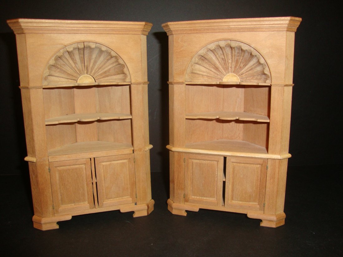 Edward Norton Corner Cupboards: A pair of unfinished corner cupboards 7" H with hand carved shell decorations by Ted Norton. There are some condition issues with joint separations and loose or missing trim, easily repaired.