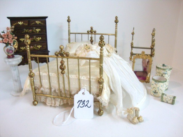 Doll Peddler Brass Bed: 6.5" L, 5" W, 5.5" H by The Doll Peddler (Ellen Krucker) with brass bedsteps, a hand-decorated highboy signed EH (missing a couple of handles), and assorted accessories.