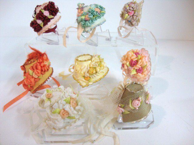Miniature Floral Bonnets: Miniature floral bonnets made by "Mini Made" , eight hats, all colors with wonderful decorative bows, flowers, just in time for Spring! 1 1/2" (t)